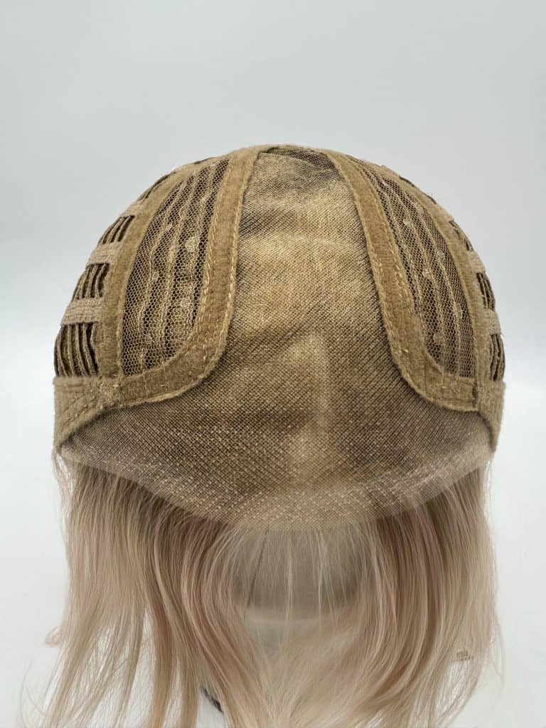 Blonde lace front wig with cap construction and adjustable straps.